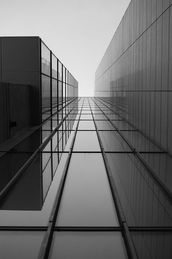 greyscale-roof-modern-building-with-glass-windows-sunlight